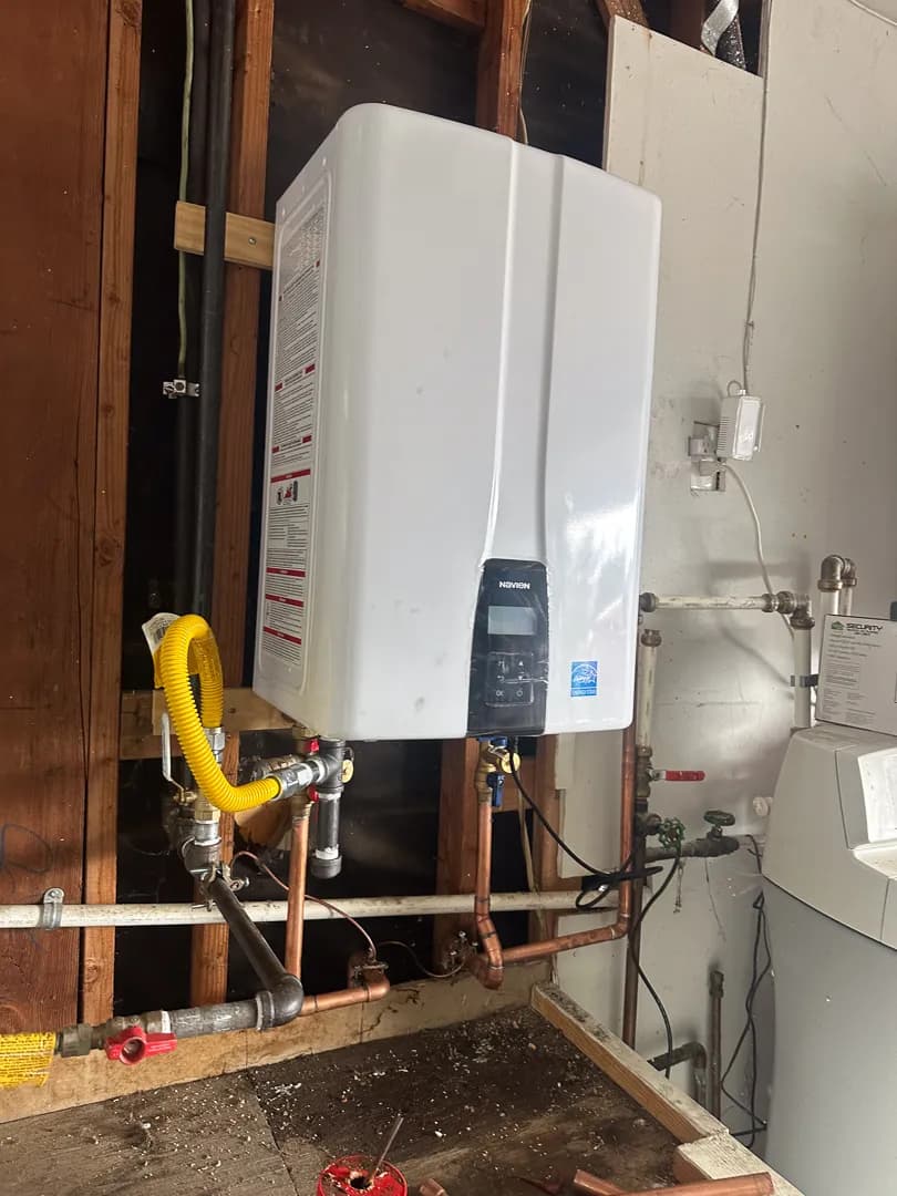 Navien tankless heater installed on garage wall